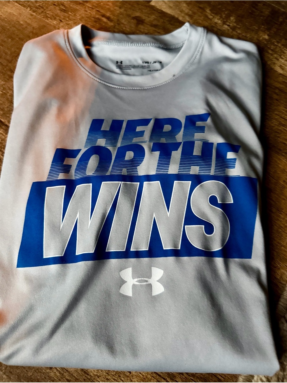 Under Armour White Tee with Bold Blue "HERE FOR THE WINS" Graphic
